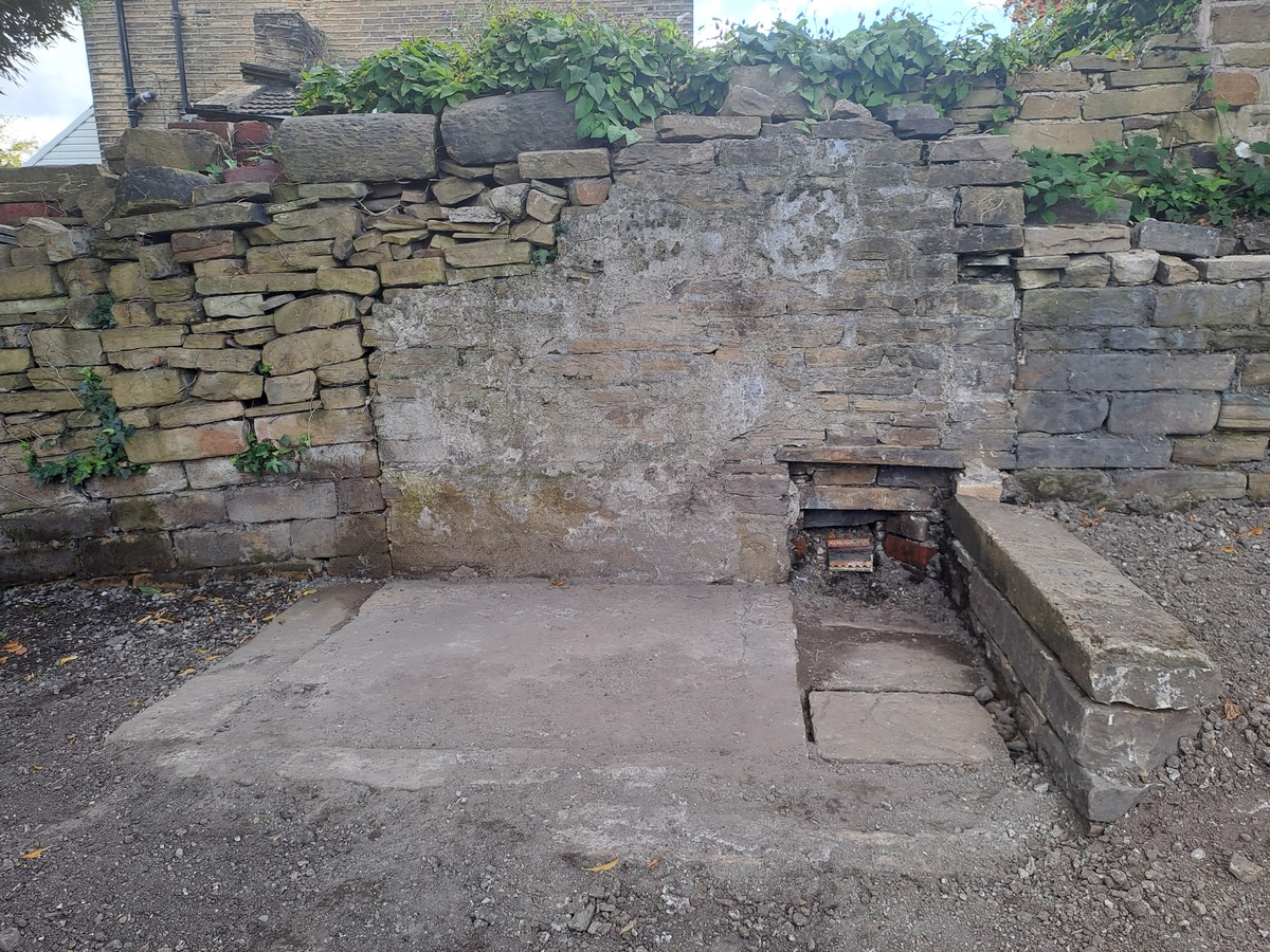 Whilst clearing the corner in Section 3 we 'dug out' the original stone flooring of what may have been the old toilet block or store shed 
